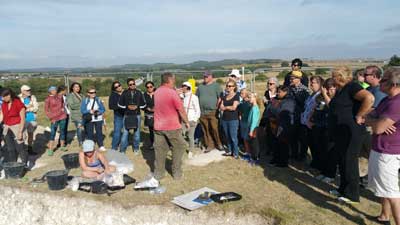 Salisbury & Stonehenge tour guests at Durrington Walls dig. 11th August 2016.