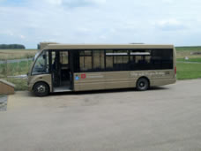 Liveried buses at Stonehenge.