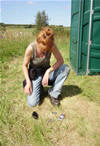 Inspecting a find from the midden.